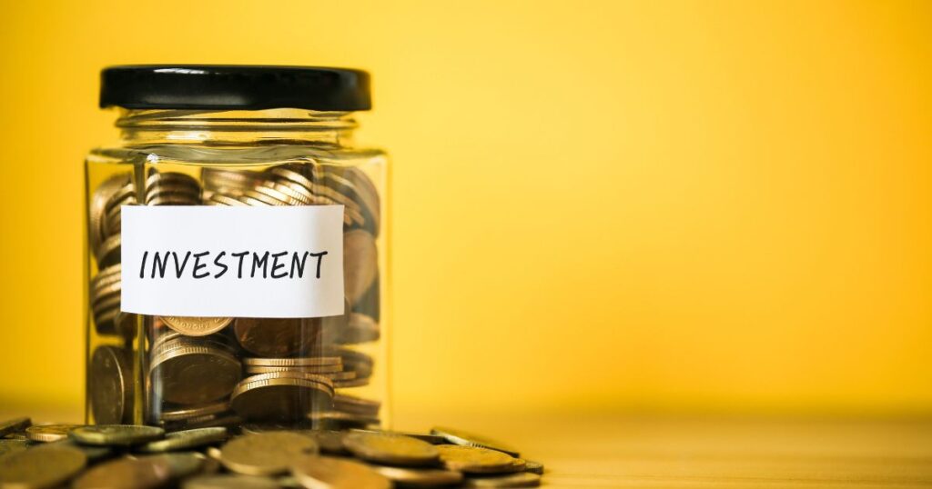 Investment jar with coins on yellow background. Saving for the future